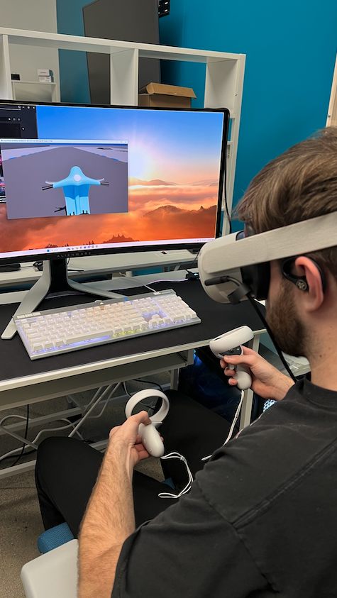 Image of Isaac Smith wearing a VR headset Tuning the simulator